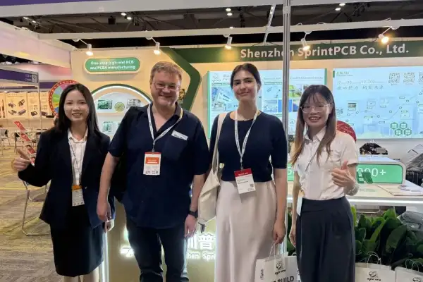 SprintPCB team and international business partners at the exhibition discussing potential PCB supply cooperation